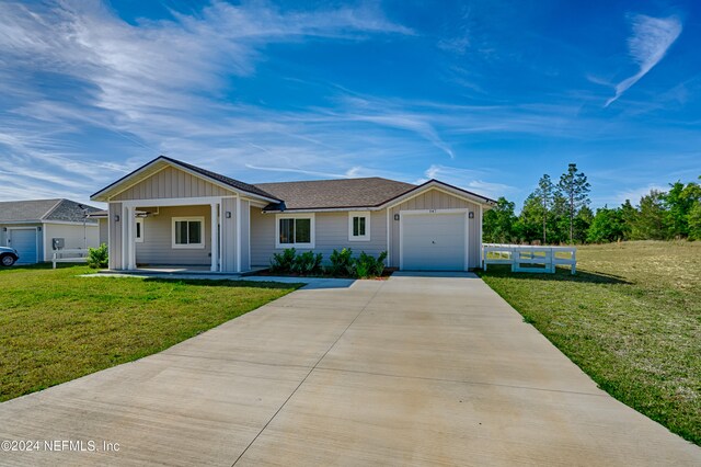 ranch-style home featuring a garage and a front yard