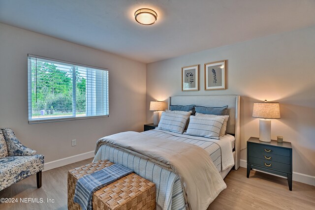 bedroom with light hardwood / wood-style floors