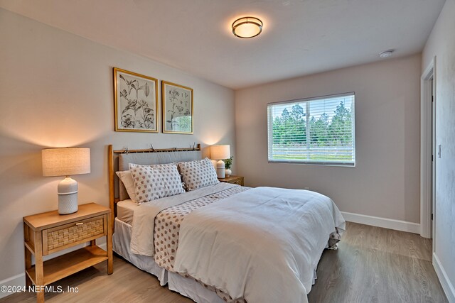 bedroom featuring light hardwood / wood-style floors