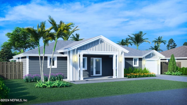 view of front facade featuring a front lawn and a garage