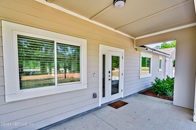 doorway to property with a patio