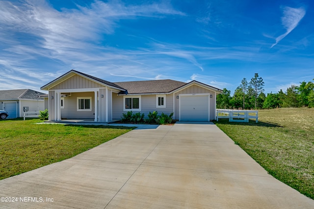 ranch-style home featuring a garage and a front lawn