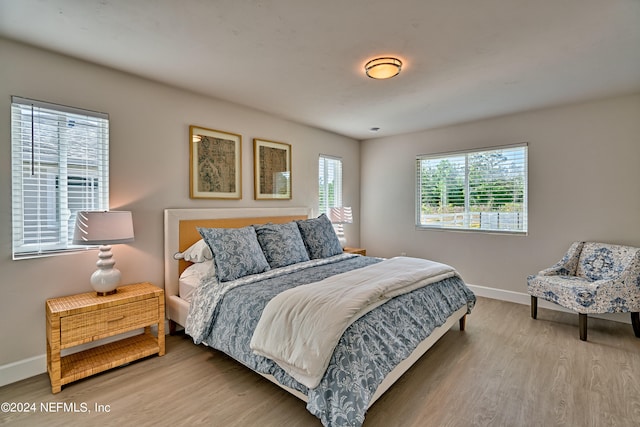 bedroom with light hardwood / wood-style floors