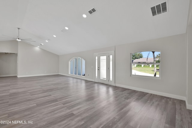 empty room featuring hardwood / wood-style floors, lofted ceiling, and ceiling fan