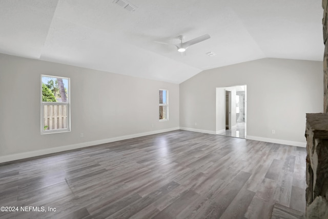 unfurnished living room with lofted ceiling, ceiling fan, and hardwood / wood-style flooring