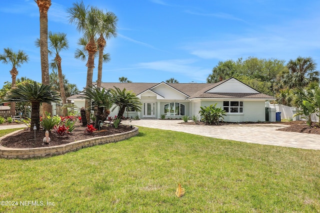 ranch-style house featuring a front lawn