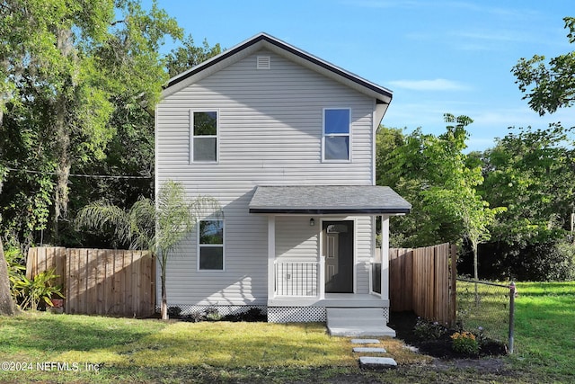 front facade with a front yard