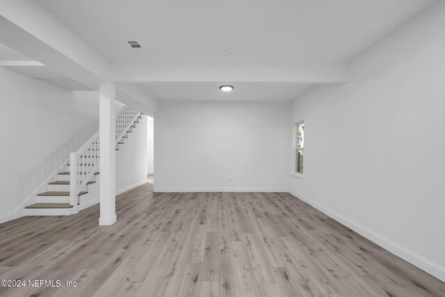 basement featuring light wood-type flooring