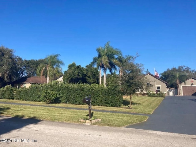 view of property exterior with a lawn