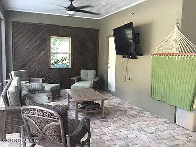 view of patio featuring an outdoor living space and ceiling fan