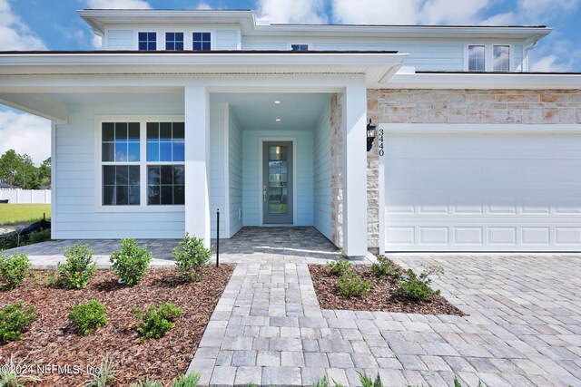 entrance to property featuring a garage