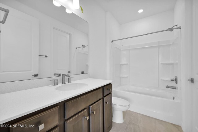 full bathroom with vanity, toilet, washtub / shower combination, and tile patterned floors