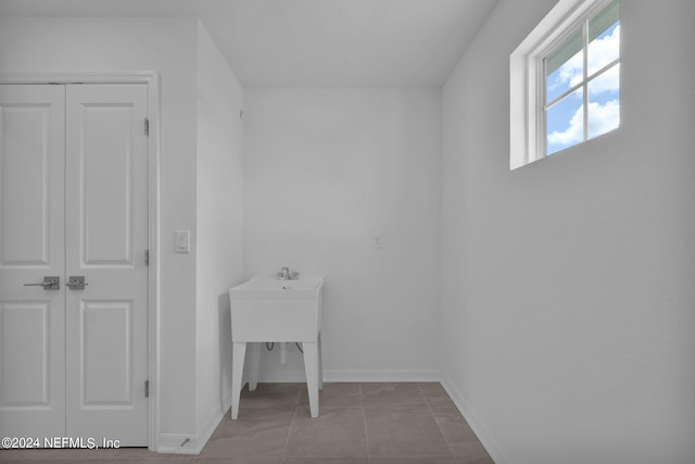 laundry room with light tile patterned flooring