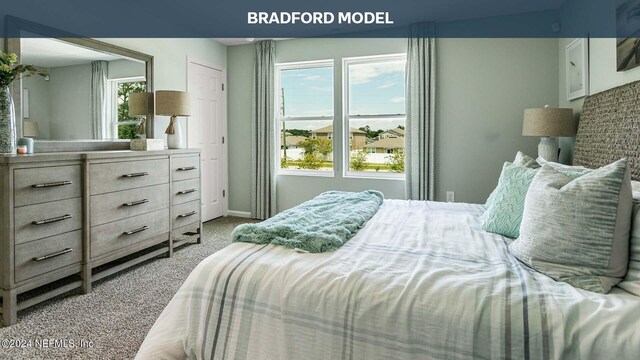 carpeted bedroom with lofted ceiling