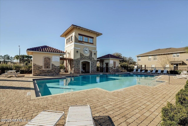 view of swimming pool with a patio