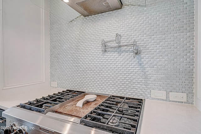 kitchen with tasteful backsplash and range