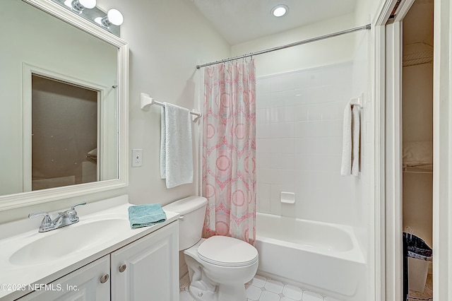 full bathroom with vanity with extensive cabinet space, toilet, tile flooring, and shower / tub combo with curtain