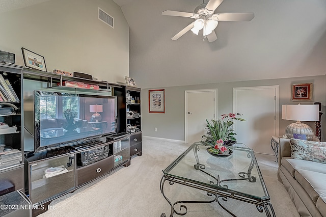 living room with light carpet, vaulted ceiling, and ceiling fan