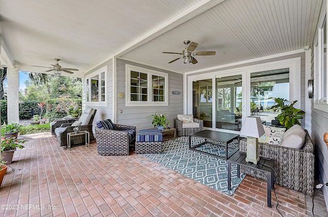 view of terrace with ceiling fan and outdoor lounge area