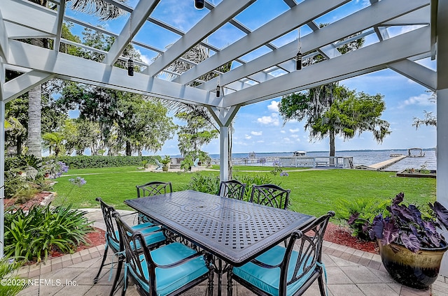 view of terrace with a water view and a pergola