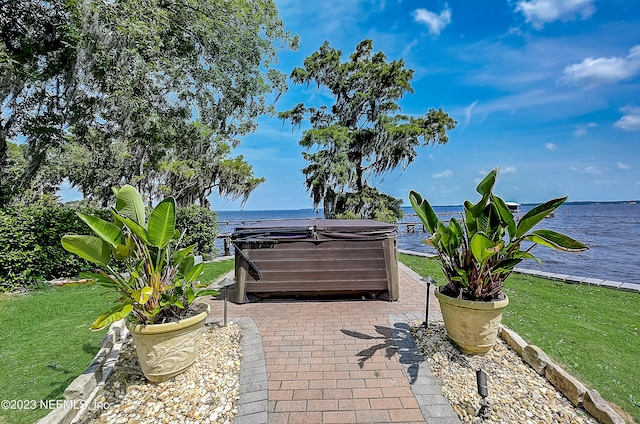 view of terrace with a water view