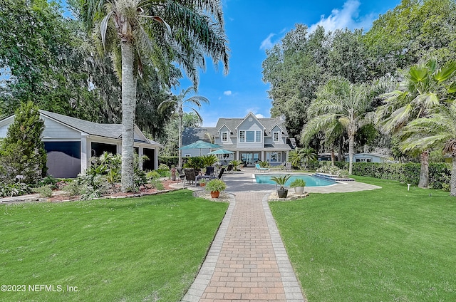 surrounding community with a swimming pool, a lawn, and a patio