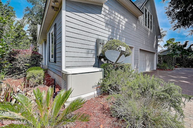 view of side of property with a garage