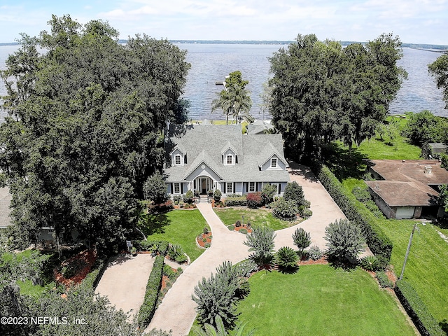 birds eye view of property with a water view