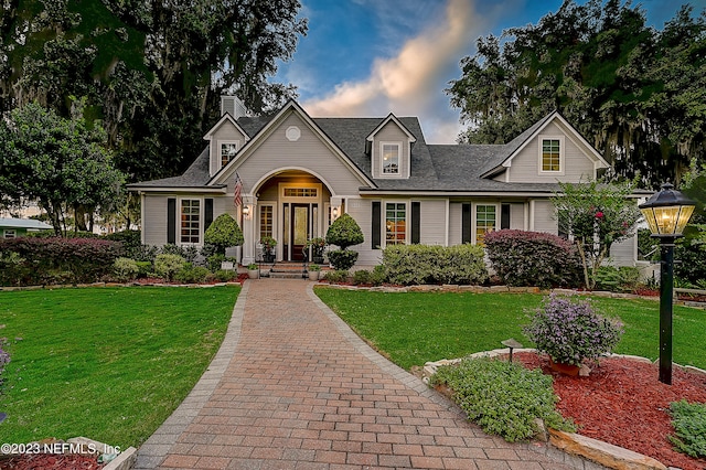 view of front of home with a lawn