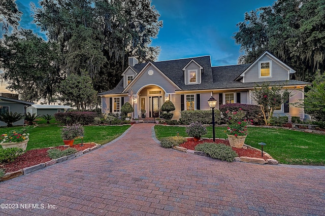 view of front of property with a yard