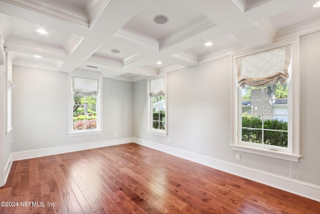 unfurnished room with ornamental molding, wood-type flooring, beam ceiling, and coffered ceiling