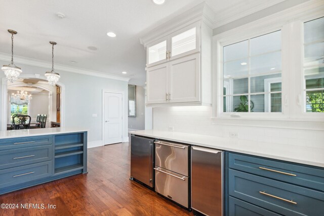 kitchen featuring tasteful backsplash, dark wood-type flooring, white cabinetry, and blue cabinetry