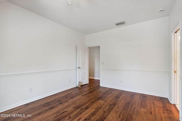 empty room featuring dark hardwood / wood-style floors