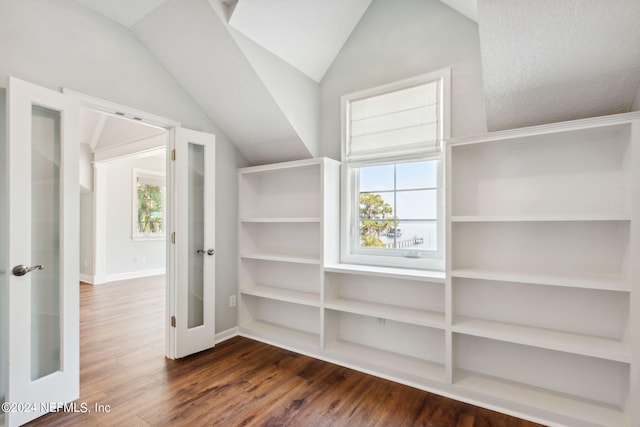 bonus room with wood-type flooring, plenty of natural light, and vaulted ceiling