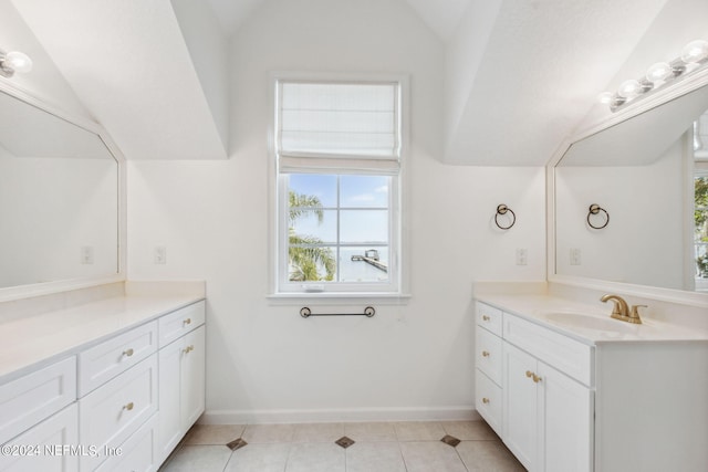 bathroom featuring lofted ceiling, vanity, and tile floors