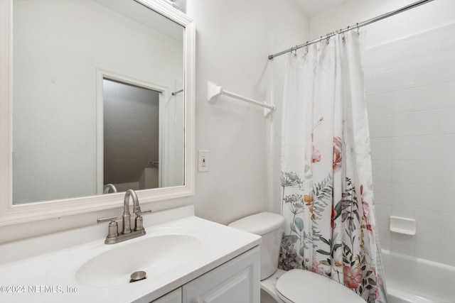 full bathroom with shower / bath combo, vanity, and toilet