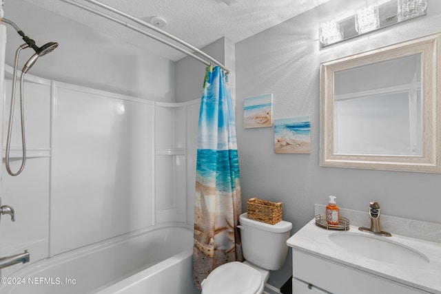 full bathroom featuring a textured ceiling, shower / tub combo, toilet, and vanity