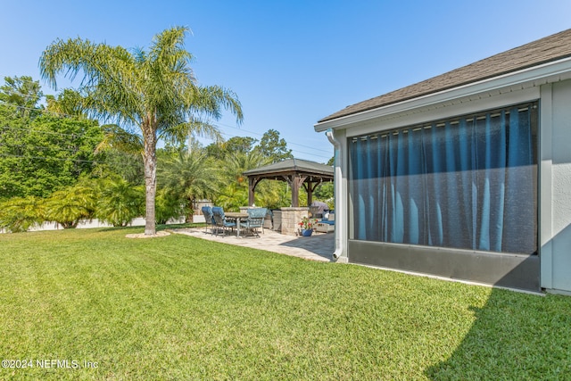 view of yard featuring a patio area and a gazebo