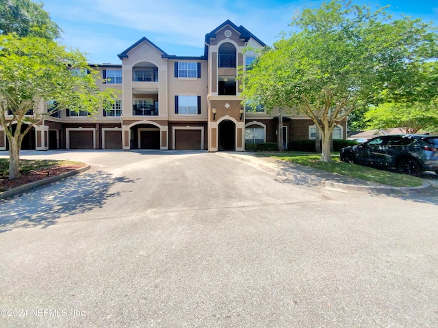 view of property featuring a balcony