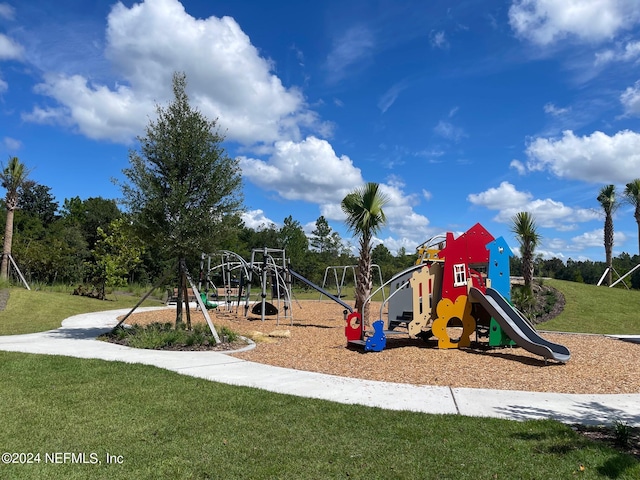 view of jungle gym with a lawn