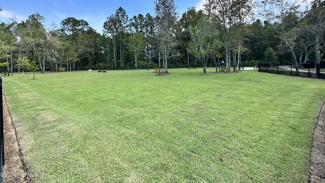 view of home's community featuring a lawn