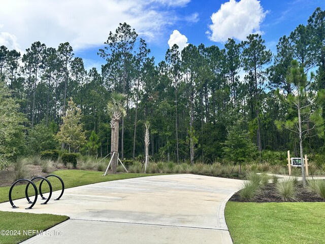 view of property's community with a yard