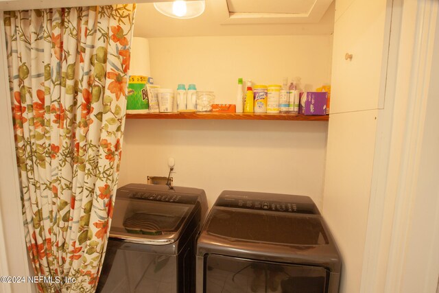 laundry room with washer hookup and washer and clothes dryer