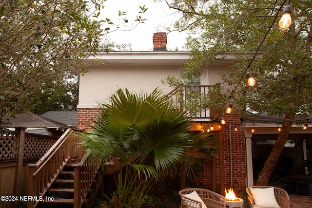 view of side of home with a wooden deck