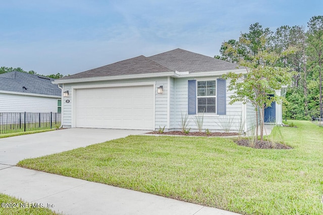 single story home featuring a front lawn and a garage