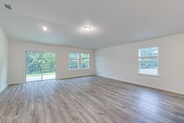 spare room featuring light wood-type flooring