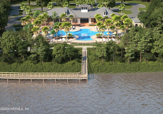 birds eye view of property with a water view