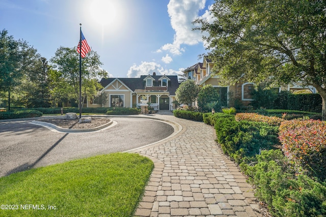 view of front of property featuring decorative driveway