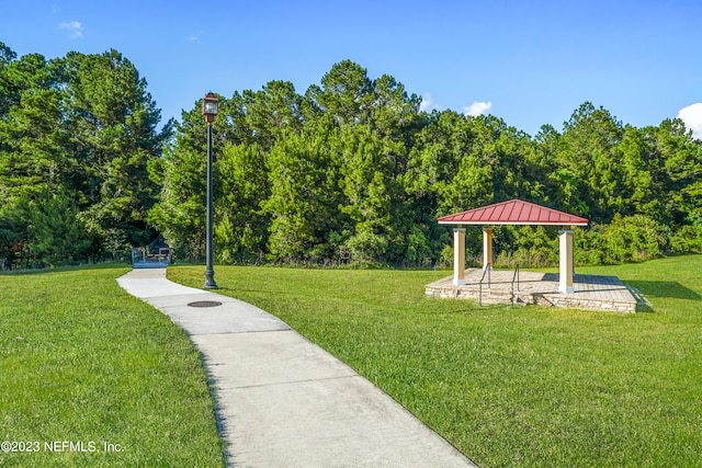 view of community featuring a lawn