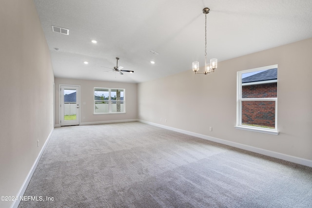 carpeted spare room featuring baseboards, visible vents, and recessed lighting